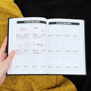 Filmmaking Planner Storyboard page with drawings and a hand holding the book. 