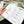 Open book with text and checklist on a textured surface