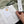 Person filling out a planner with notes on a textured surface