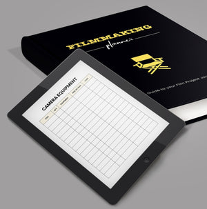 iPad open on Filmmaking Digital Planner Camera Equipment page, next to hardback filmmaking planner.