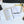 Notebook with film identity planning on a desk with pens and a keyboard.