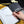 Meeting notes with lined paper and a hand holding a pen saying never give up.  