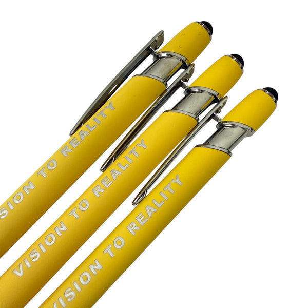 Three yellow pens with 'Vision to Reality' text on a white background
