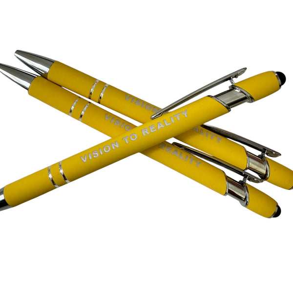 Yellow pens with 'Vision to Reality' text on a white background