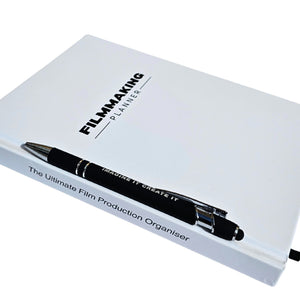 Filmmaking planner with a pen on a white background