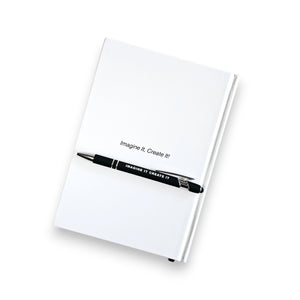 White notebook with a pen on a white background